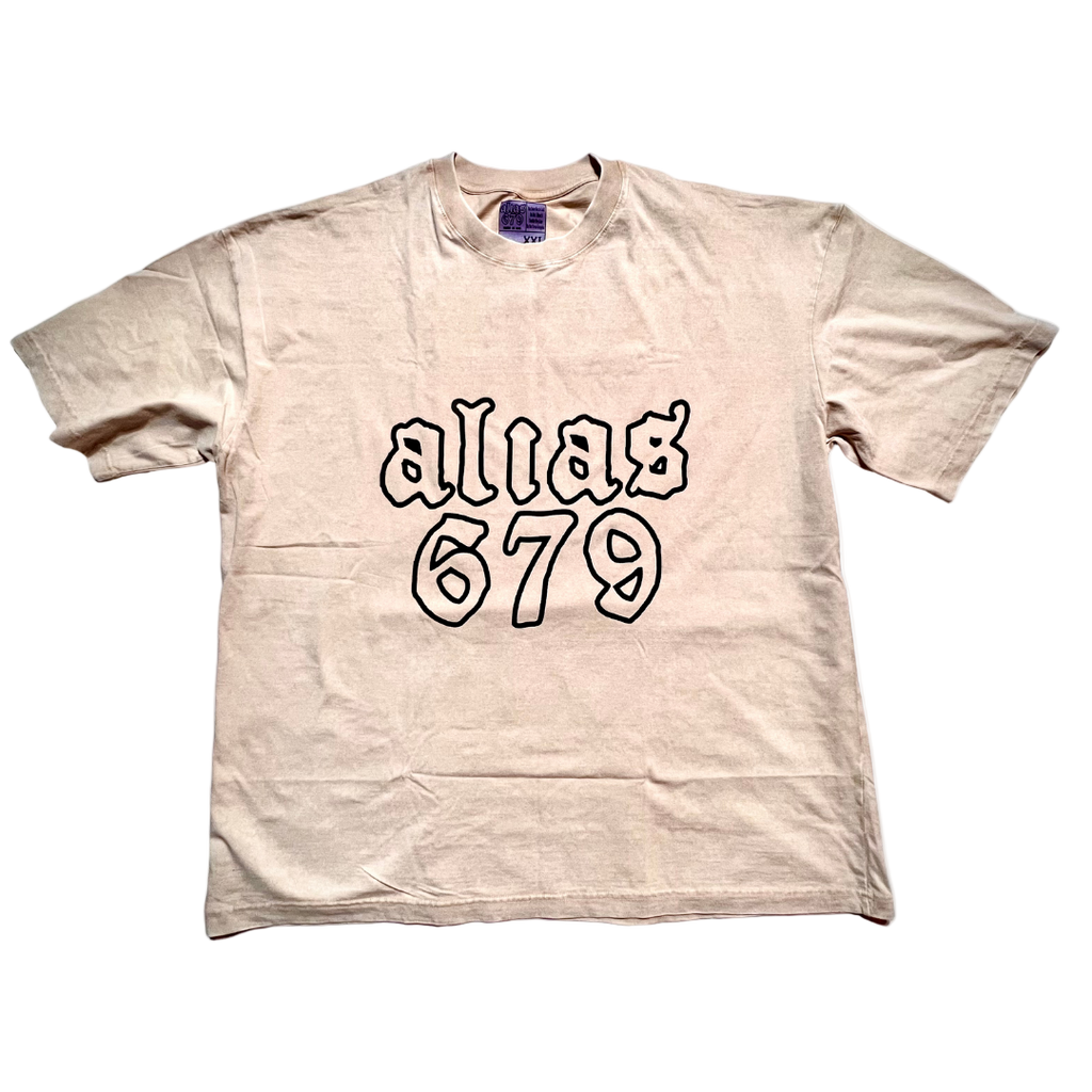 Beige t-shirt with 'alias 679' text on a white background