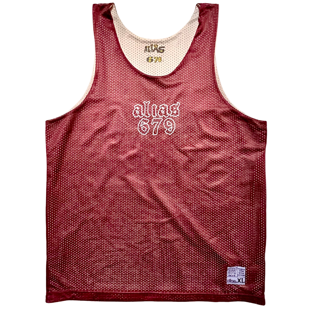 Red mesh tank top with 'alias 679' branding on a white background
