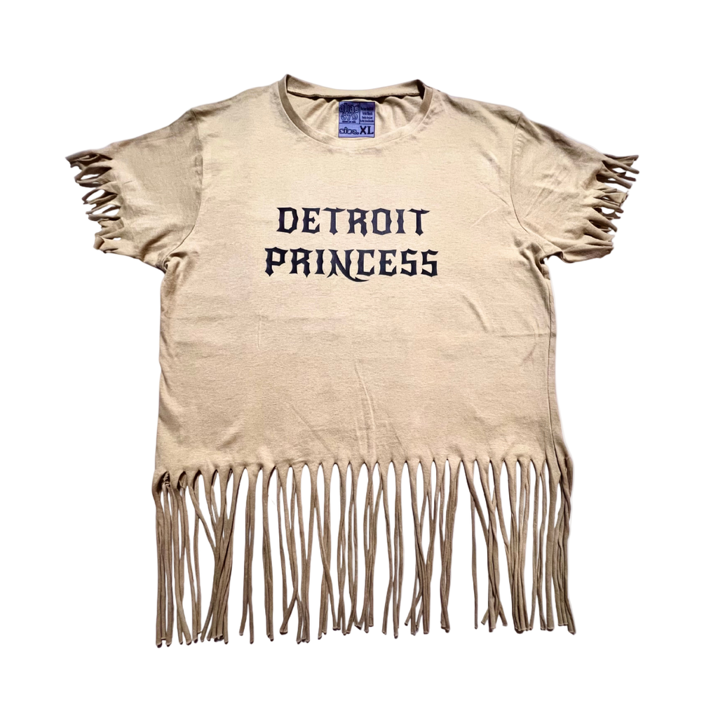 Beige t-shirt with 'Detroit Princess' text and fringe details on a white background