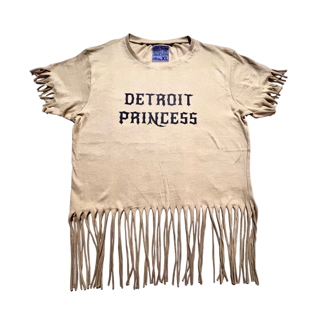 Beige t-shirt with 'Detroit Princess' text and fringe details on a white background